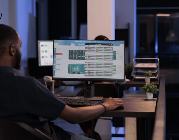 Financial broker looking at stock market exchange statistics with global money trade and profit on computer screen. Analyzing real time forex data report to make hedge fund investment.